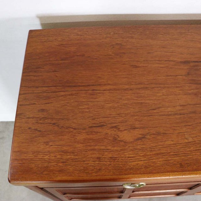 Vintage British Nathan teak sideboard top showing rich mid-century wood grain and smooth finish.