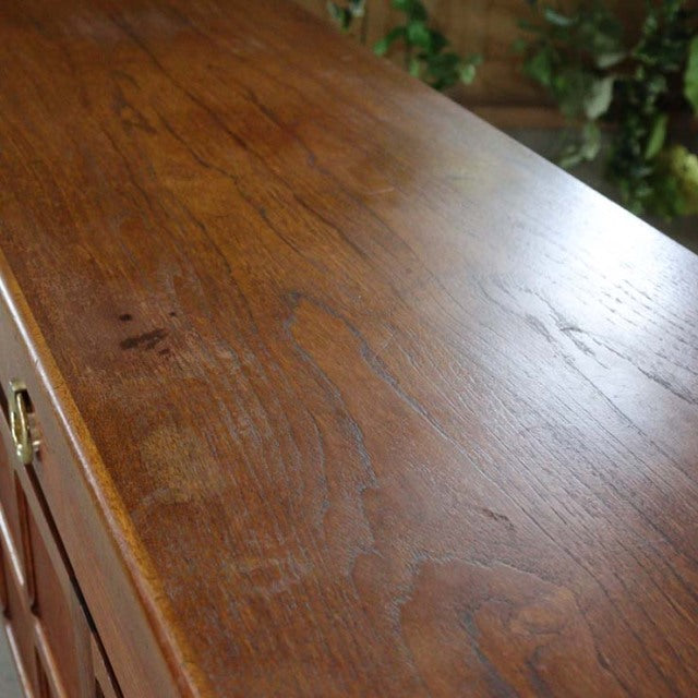 Vintage teak sideboard top showcasing rich wood grain and smooth mid-century British craftsmanship by Nathan.