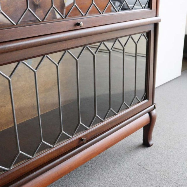 Vintage teak Globe Wernicke glass bookcase with British mid-century design, diamond-patterned glass panels and elegant.