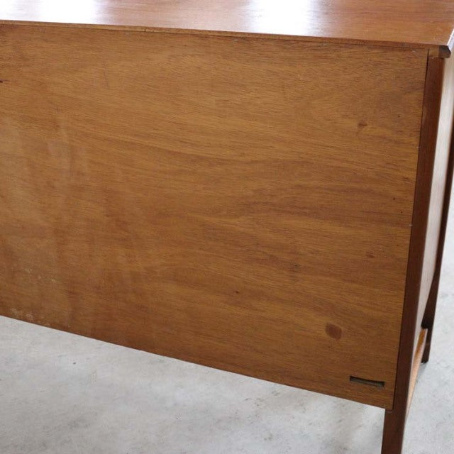 Mid-century British vintage Nathan teak sideboard with smooth wood grain and slender tapered legs from Denmark.