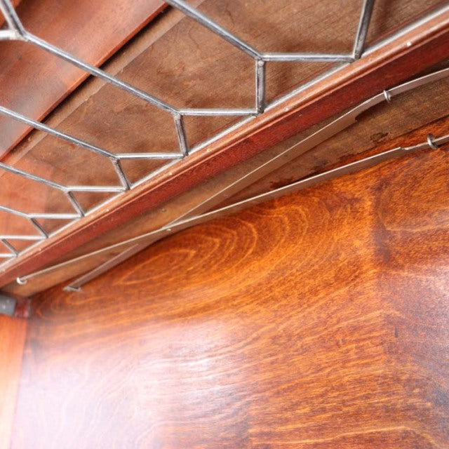 Vintage Globe Wernicke teak glass bookcase with mid-century British design, detailed wood grain and leaded glass panels from .