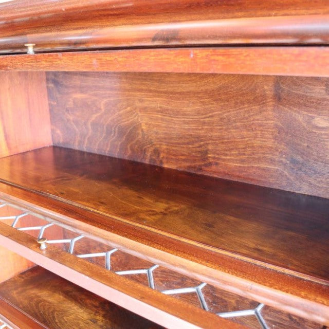 Vintage teak Globe Wernicke glass bookcase interior with rich wood grain and mid-century British craftsmanship.