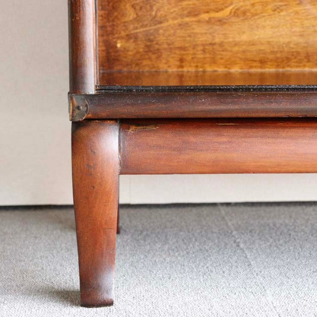 Mid-century British teak cabinet leg with rich wood grain and Globe Wernicke vintage craftsmanship detail.