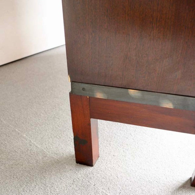 Mid-century British teak Globe Wernicke glass bookcase leg with rich wood grain and brass trim detail.