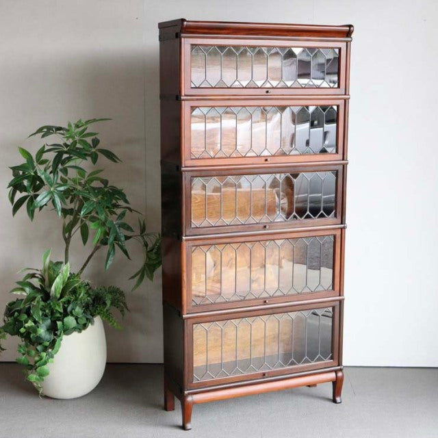 Vintage teak Globe Wernicke glass bookcase with four stacked compartments, British mid-century design, intricate wooden.