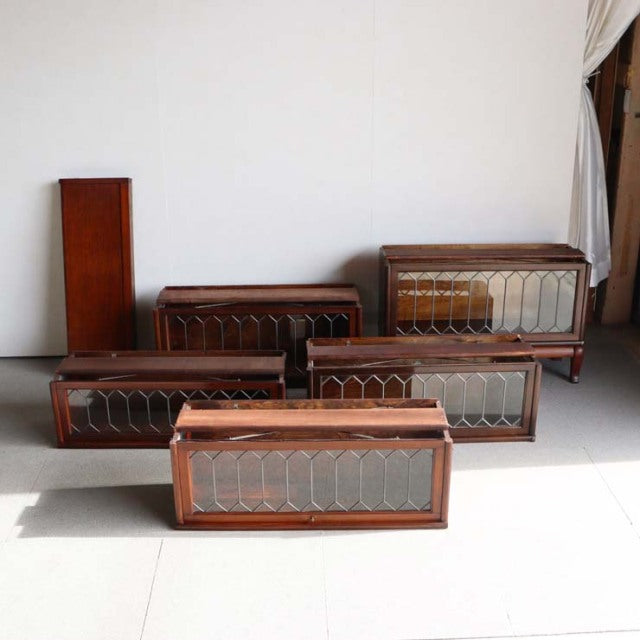 Set of five vintage teak Globe Wernicke glass bookcase sections with British mid-century design, intricate wood grain, and.