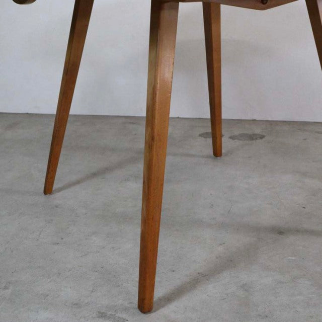 Mid-century British vintage Ercol dining table leg in warm teak with visible wood grain and tapered design.