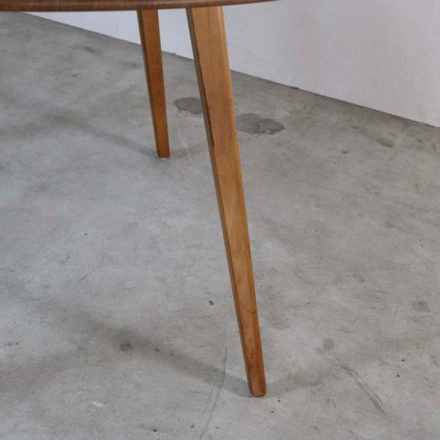 Vintage teak dining table leg with tapered mid-century British design, smooth wood grain.