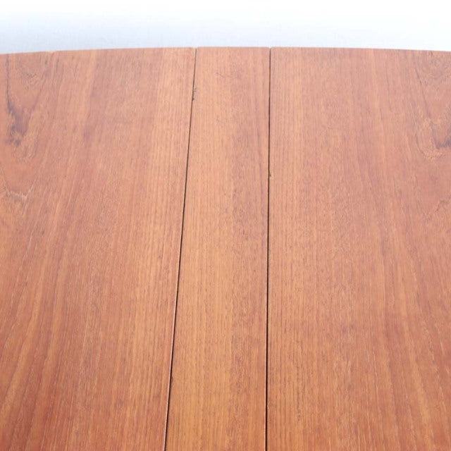 Vintage mid-century teak dining table top with visible wood grain and foldable design, British-Denmark style.