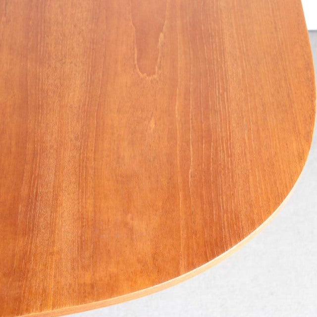 Vintage mid-century teak dining table with smooth rounded edge, showcasing fine wood grain from British-Denmark design.