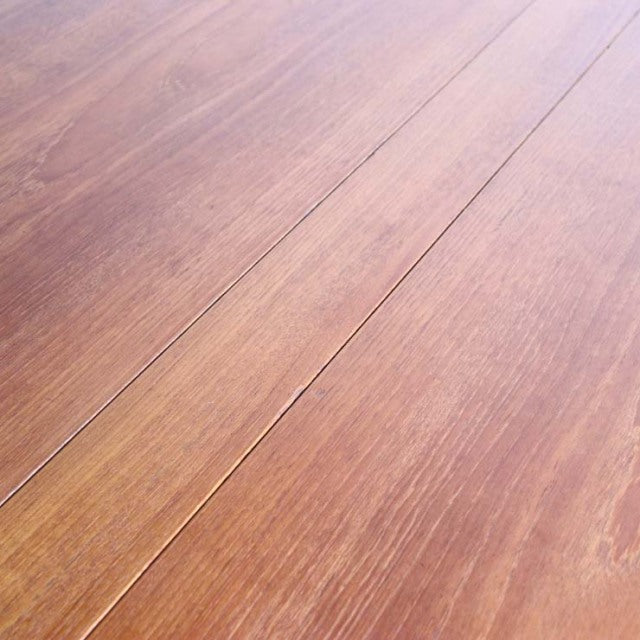 Vintage teak dining table surface with warm wood grain and smooth mid-century finish.