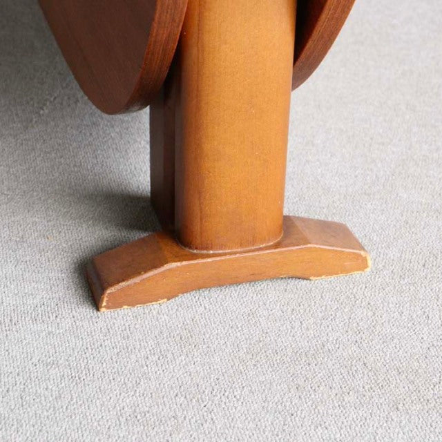 Mid-century British vintage teak dining table leg with rounded base and rich wood grain detailing.