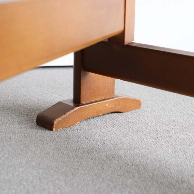 Mid-century vintage teak dining table leg with British craftsmanship, smooth wood grain and sturdy curved base.
