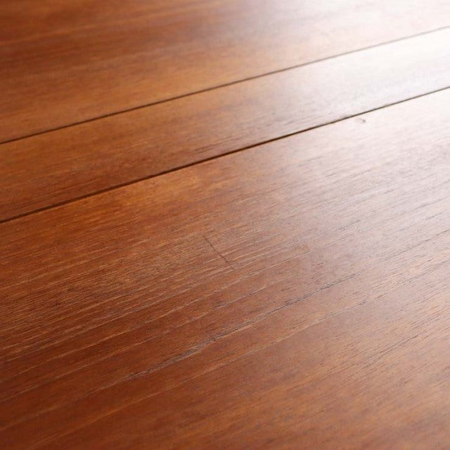 Vintage mid-century teak dining table top displaying rich wood grain with a smooth, warm brown finish from British-Danish.