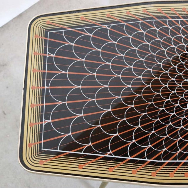 Mid-century teak coffee table with intricate geometric patterned top featuring overlapping arcs in black, orange, and cream, .