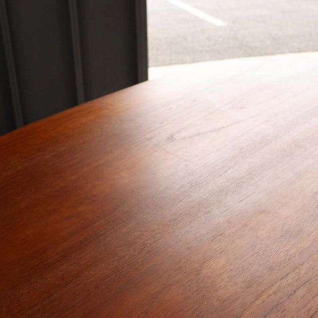 Vintage teak dining table top with smooth wood grain, warm mid-century finish, British-Denmark design.