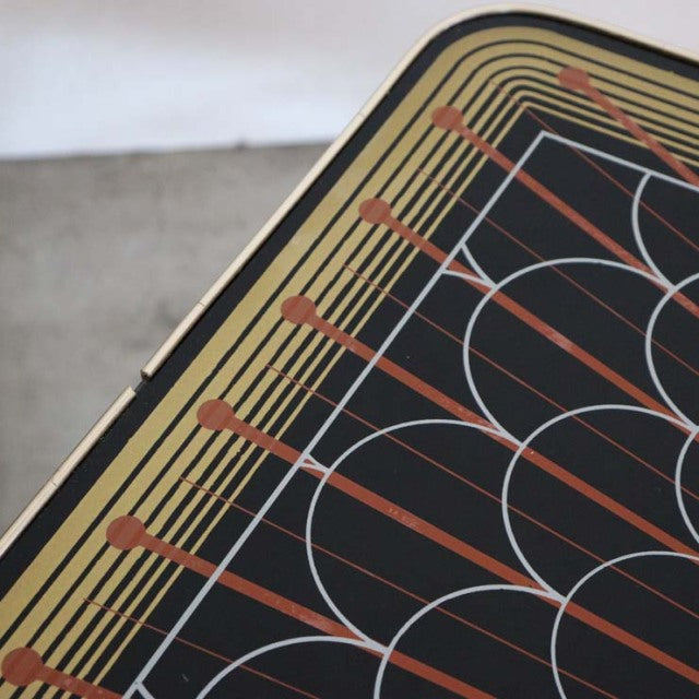 Vintage mid-century teak coffee table top with bold geometric pattern in black, mustard, and burnt orange, showcasing.