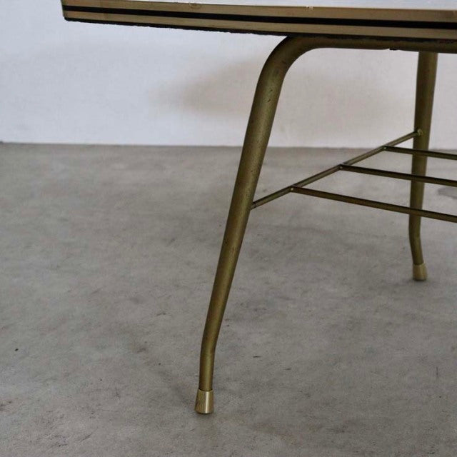Mid-century teak coffee table leg with British vintage design, slender metal frame, and brass foot cap.