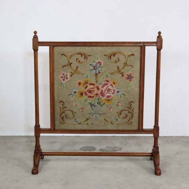 Vintage teak British mid-century firescreen with floral tapestry and turned wood legs.