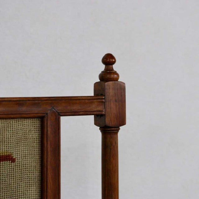 Vintage mid-century teak fire screen with turned wooden finial and woven fabric panel, British craftsmanship visible in rich .