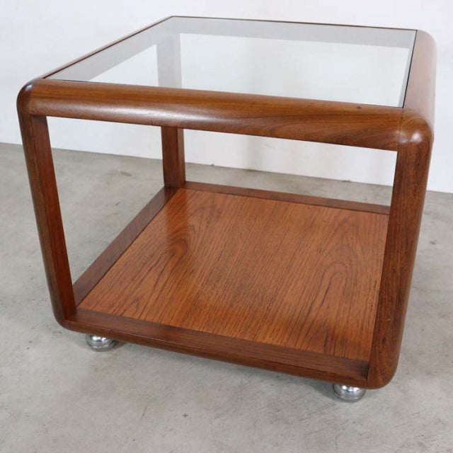 Vintage mid-century G-Plan teak and glass cube coffee table with rounded edges and visible wood grain on lower shelf.