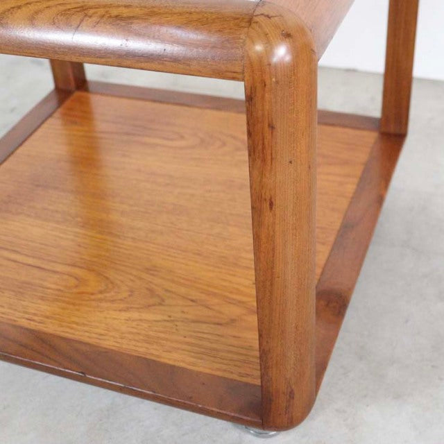 Vintage British teak mid-century cube coffee table with rounded corners and visible wood grain.