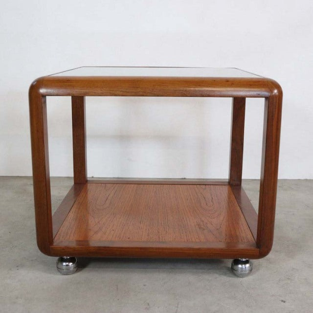 Vintage G-Plan teak cube coffee table with mid-century British design, rounded edges, glass top, and visible wood grain on.