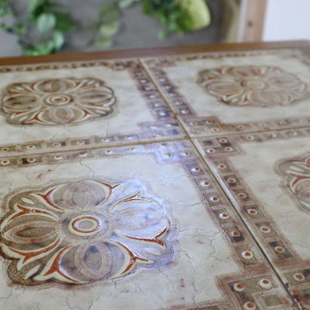 Vintage teak G-Plan Nest Table top with embossed floral tile design and mid-century British-Denmark craftsmanship.