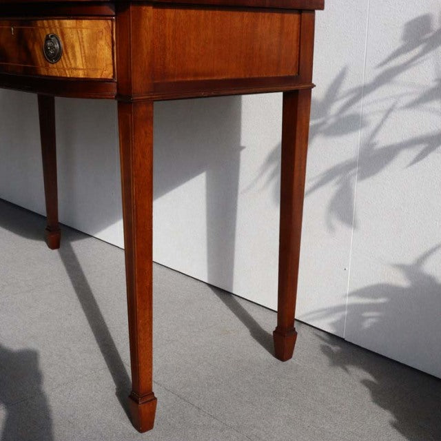 Vintage British mid-century teak desk leg with tapered square profile and smooth wood grain finish.