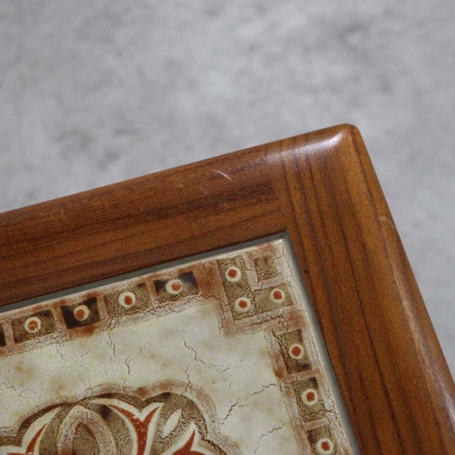 Vintage G-Plan teak nest table corner with British mid-century design and decorative Danish tile inset.