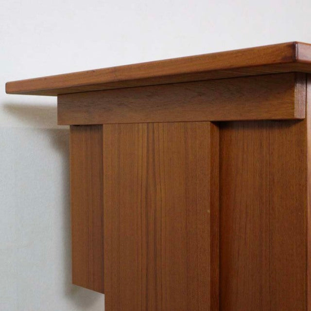 Mid-century vintage teak desk corner with clean lines and rich wood grain from Denmark.