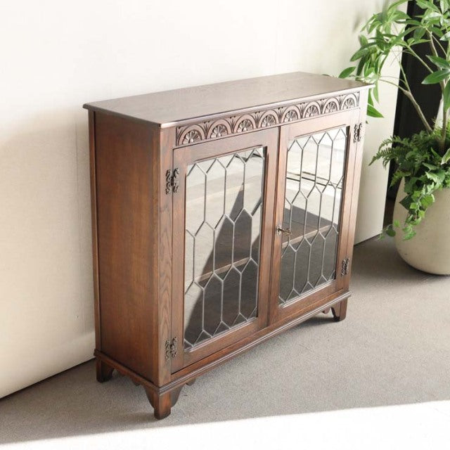 Vintage teak cabinet by Jaycee, British mid-century design, detailed wood grain, glass paneled doors with geometric leaded.