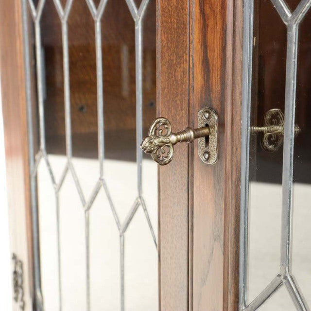 Vintage teak British mid-century Jaycee cabinet door with leaded glass panes and ornate brass key lock.