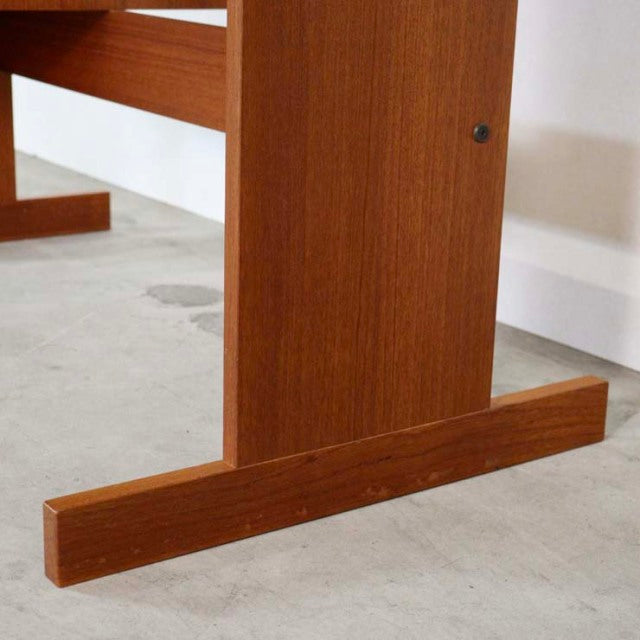 Mid-century vintage teak wood desk leg with visible rich grain and clean Danish design lines.