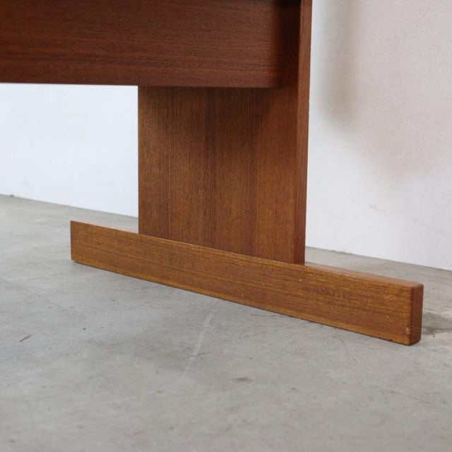 Mid-century Danish vintage teak desk leg with rich wood grain and simple, sturdy design.