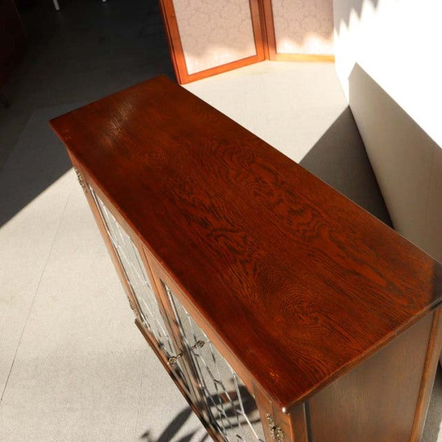 Vintage mid-century teak cabinet by British-Danish Jaycee, rich wood grain, sleek polished surface, slender legs.