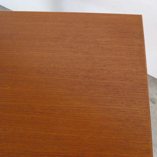Mid-century vintage teak desk top with smooth wood grain, Danish design, clean rectangular edges.