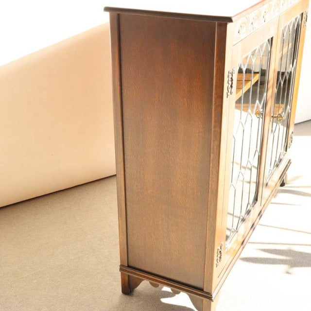 Vintage mid-century teak cabinet by British Jaycee, featuring rich wood grain and tapered legs.