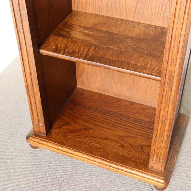 Vintage teak cabinet shelf with rich wood grain, British mid-century design, solid oak frame, sturdy base molding.