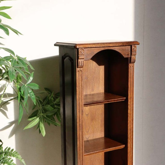Vintage British teak cabinet with mid-century design, ornate carved details, open shelves, and warm wood grain finish.