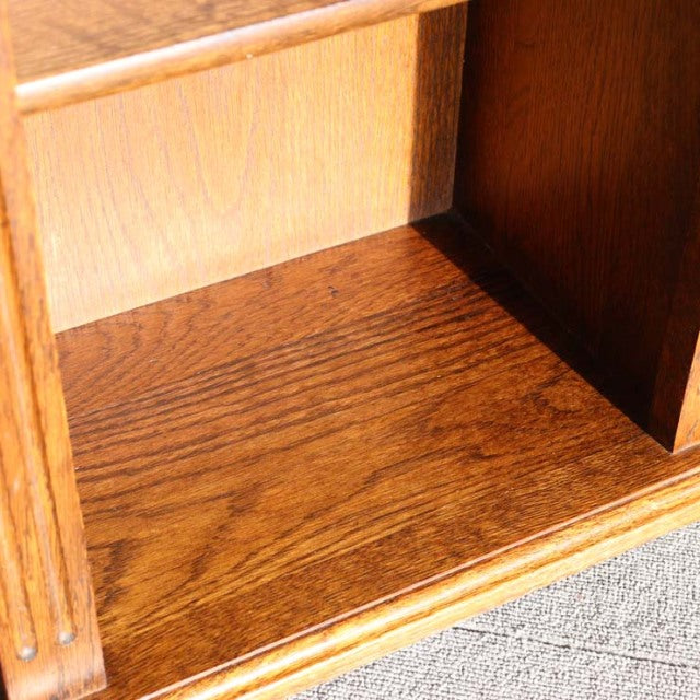 Vintage teak cabinet interior corner showing rich wood grain and craftsmanship in British mid-century Danish style.