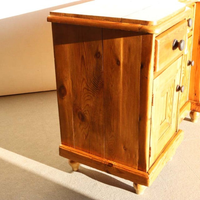 Vintage teak sideboard with rich wood grain, sturdy legs, and mid-century British-Denmark design.