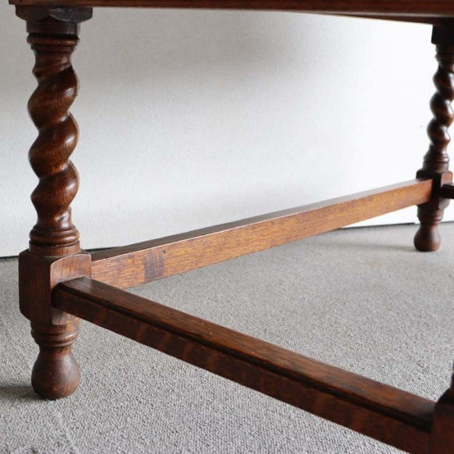 Vintage British teak cabinet leg with twisted barley twist design, mid-century craftsmanship from 1930s Denmark, showcasing.