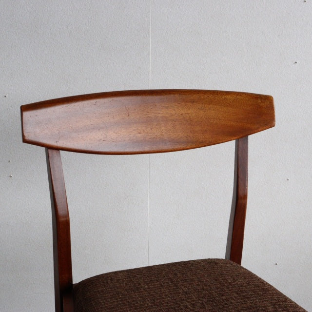 Vintage McIntosh dining chair in teak with mid-century British design, curved wood grain backrest, and brown upholstered.