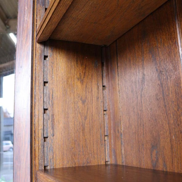 Interior close-up of vintage British mid-century teak cabinet showing rich wood grain and adjustable shelf grooves.