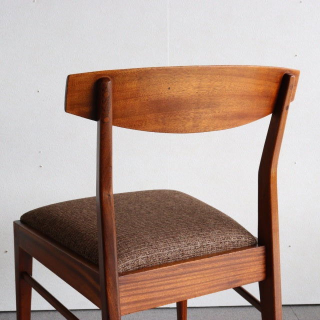 Vintage McIntosh dining chair in teak with curved British mid-century backrest and tapered legs, brown upholstered seat.