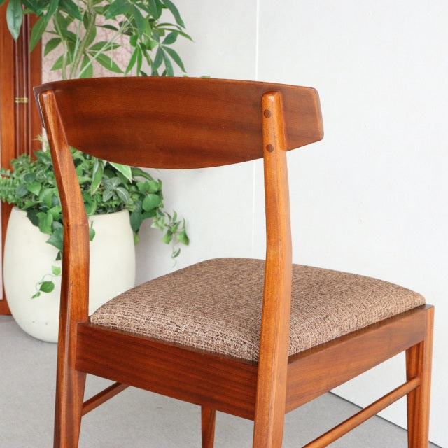 Vintage teak dining chair by McIntosh, British mid-century design with curved backrest and textured fabric seat.