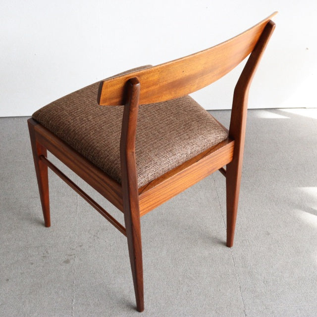 Vintage mid-century McIntosh teak dining chair from Denmark with curved backrest and brown upholstered seat.