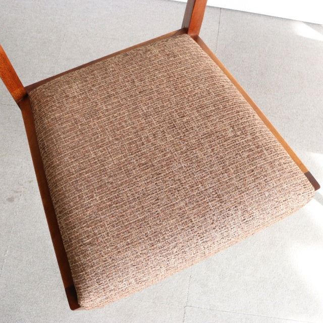 Mid-century vintage teak dining chair seat with textured brown upholstery and visible wood grain edges from British.