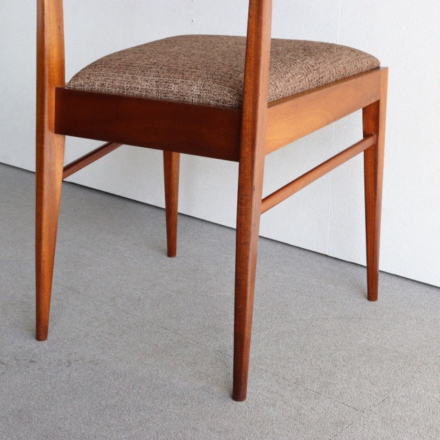Vintage McIntosh teak dining chair with tapered legs, mid-century British design, textured brown upholstered seat, and.